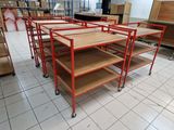 many shelves that are on the floor in the room