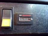 a close up of a clock on a car ' s dashboard