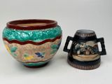 two vases sitting next to each other on a table