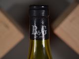 a bottle of wine that is sitting on a table
