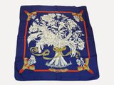 blue silk scarf with white flowers and a red border