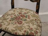 a chair that has a floral seat and back
