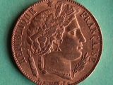 a close up of a coin on a green surface