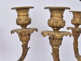 three candles that are sitting on a table