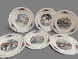 six plates with a picture of a horse drawn carriage on them