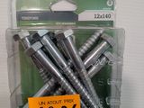 four screws in a package with a price tag on it