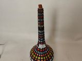 a vase that has a colorful design on it