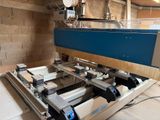 an image of a machine that is working on a piece of wood