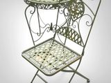 an image of a small table with a chair on top of it