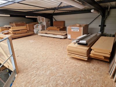 a large warehouse filled with lots of wooden planks