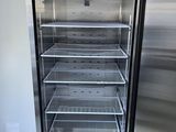 a refrigerator that has a lot of food inside of it