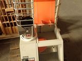 a picture of an orange chair sitting on top of a wooden pallet