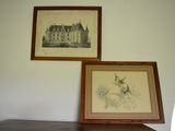two framed pictures on the wall above a dresser
