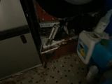 a dirty washer and dryer in a dirty room