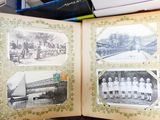 a book opened to show pictures of a group of people