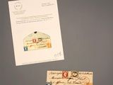 two envelopes and a piece of paper on a table