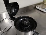 stainless steel counter top with a juicer and a blender on it