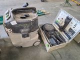 a dust collector and a dust collector in a garage