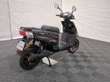 a scooter that is parked in a garage