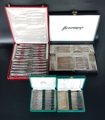 a lot of silverware in a case on a table