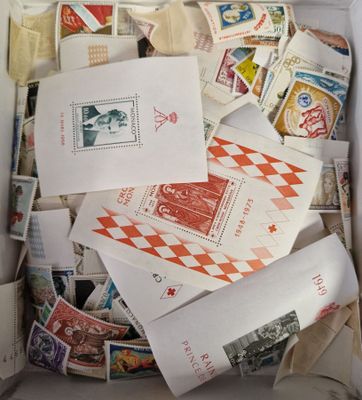 a box full of stamps and envelopes sitting on a table