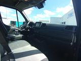 a view of the inside of a truck from the driver ' s seat