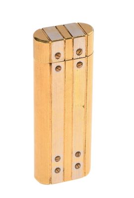 a gold lighter that is sitting on a white surface