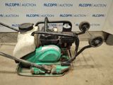 an image of a lawn mower sitting on the ground