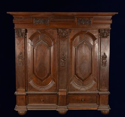 an antique wooden cabinet with two doors and two drawers