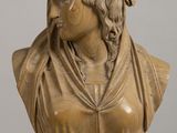 bust of a woman with braids on her head