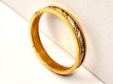 a picture of a gold ring with diamonds on it