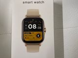 a box with a smart watch on it sitting on a table