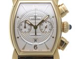 an image of a watch with a gold case and brown leather strap