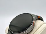 a smart watch sitting on top of a display stand