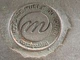 a close up of a metal object with a logo on it
