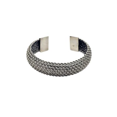a close up of a metal bracelet with a chain on it