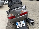 a motorcycle that is parked on the side of the road