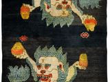 an oriental rug with two images of a demon and a demon on it