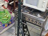 a microwave oven sitting on top of a stove in a room