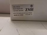 an image of a white sewing machine on a table