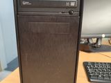 a desktop computer sitting on a desk with a keyboard