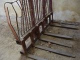 a wooden bench that is sitting in the dirt