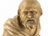 a statue of a man with a beard and a robe
