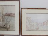 two framed pictures of boats on the water in a room