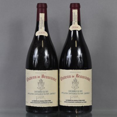 two bottles of red wine sitting on top of a glass table