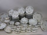 many different types of plates and bowls on the table