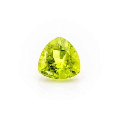 a trillion shaped green peridot gems on a white background