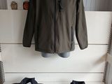 two jackets on display in a store with a mannequin