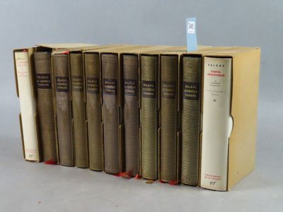 several books are stacked on top of each other in a row