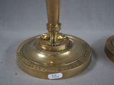pair of antique brass candlesticks with ornate decoration